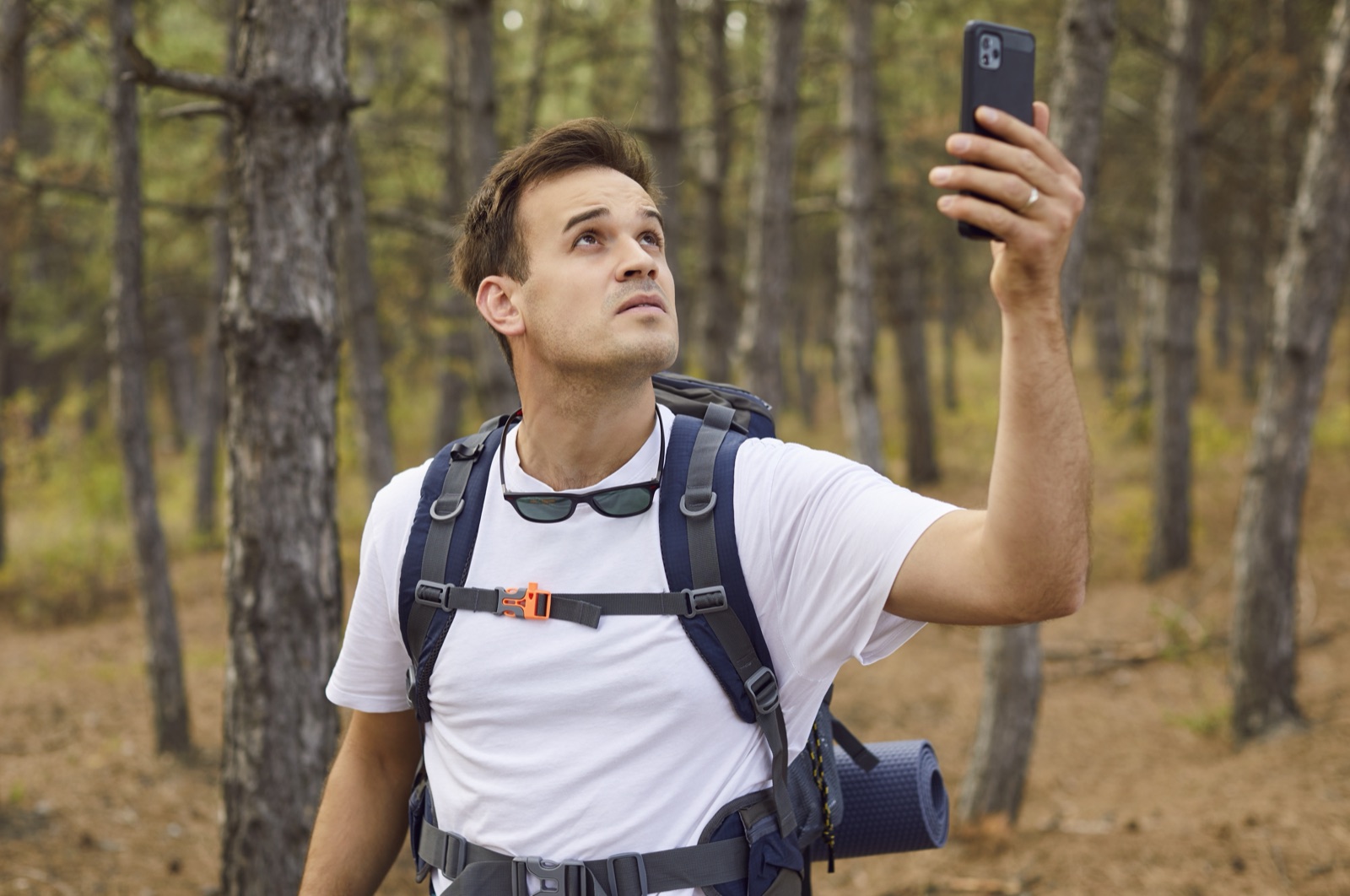 Hiker in a mountain forest with no phone signal